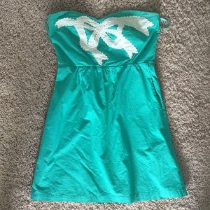 Teal strapless dress with white bow